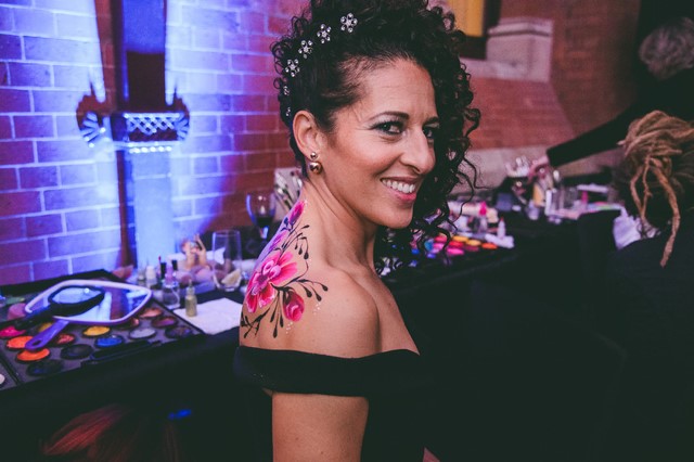 bright roses painted as back piece